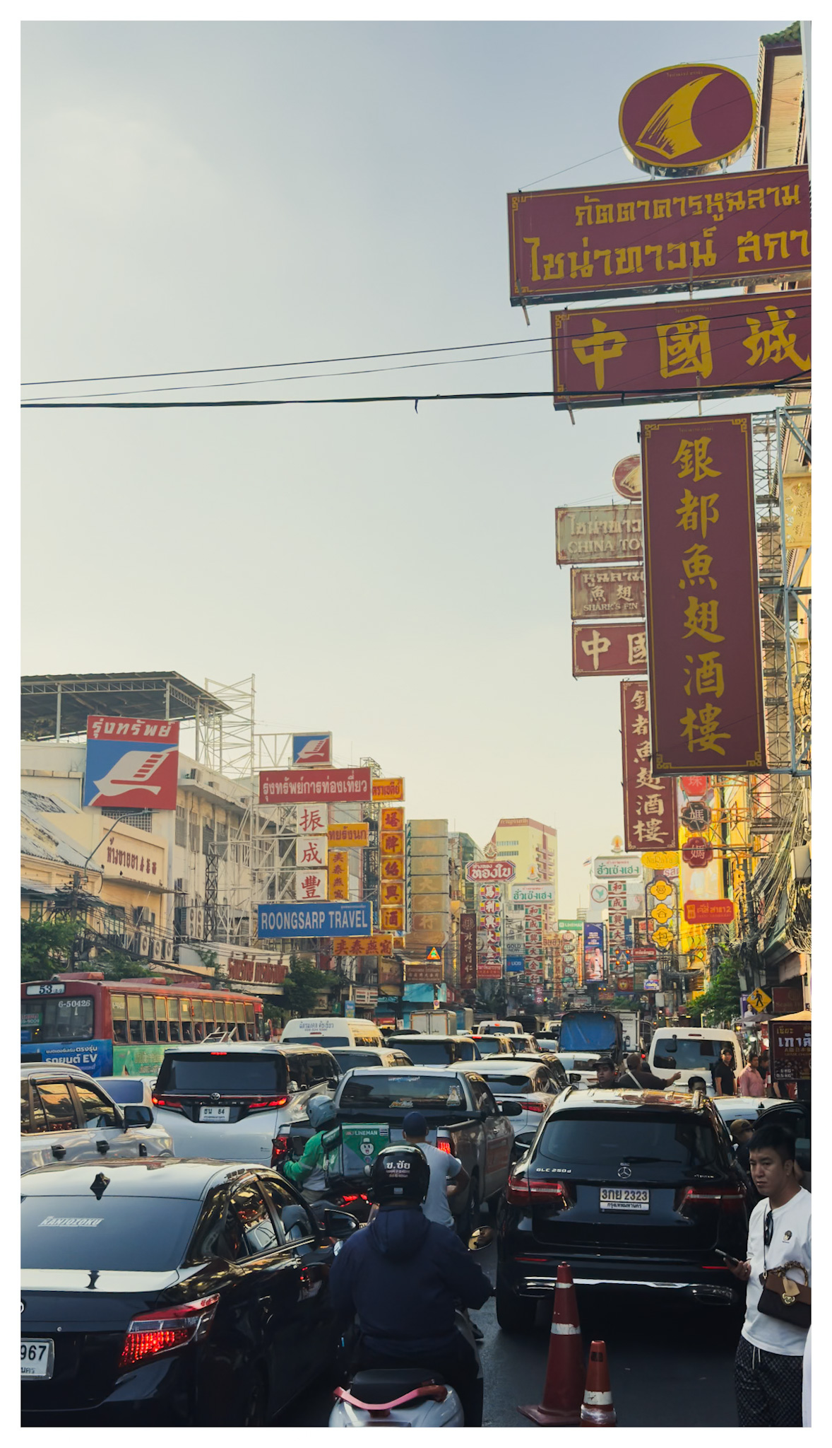 Signs and traffic on a busy Bangkok street